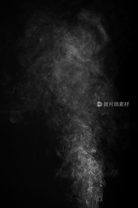 White and gray smoke against black background